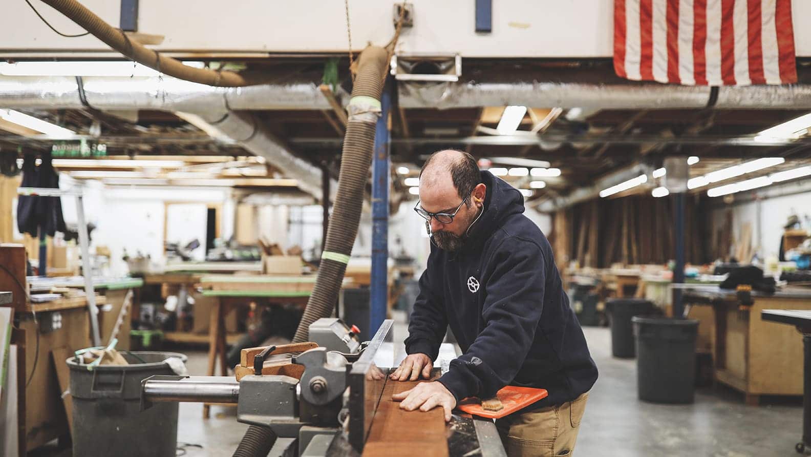 man cutting wood