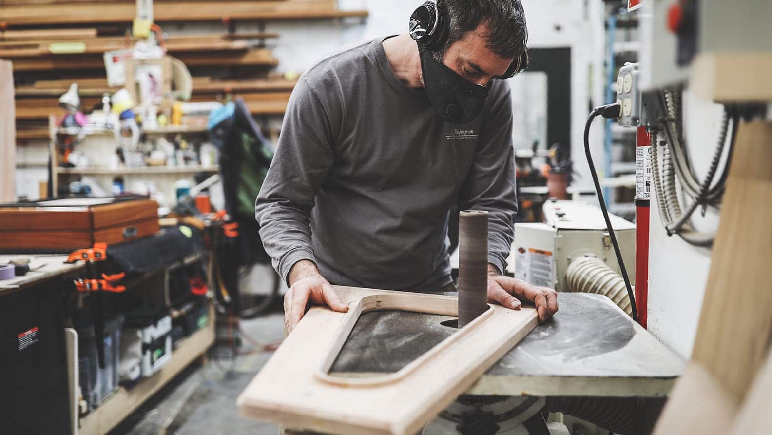 man cutting wood