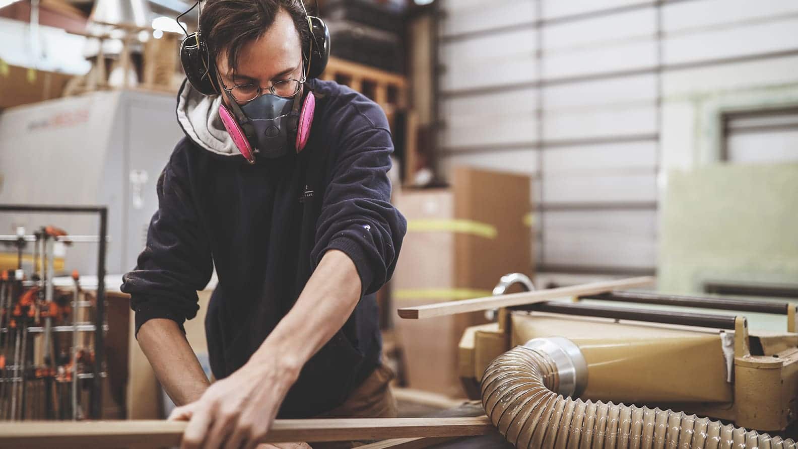 man cutting wood