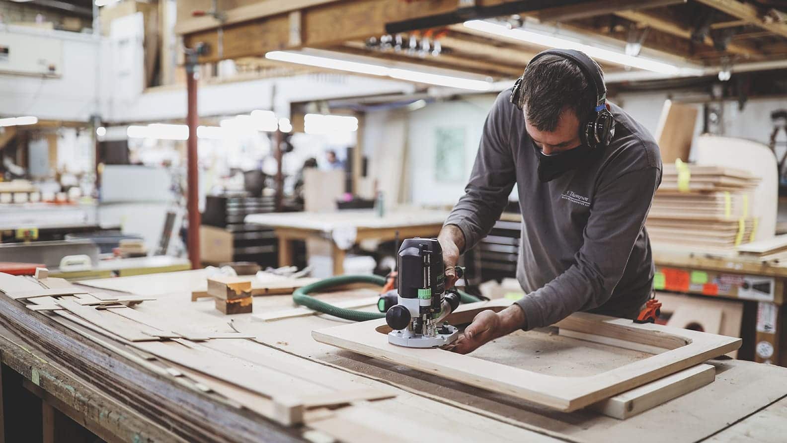 man cutting wood
