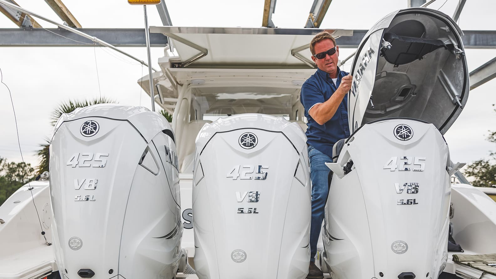 man inspecting boat