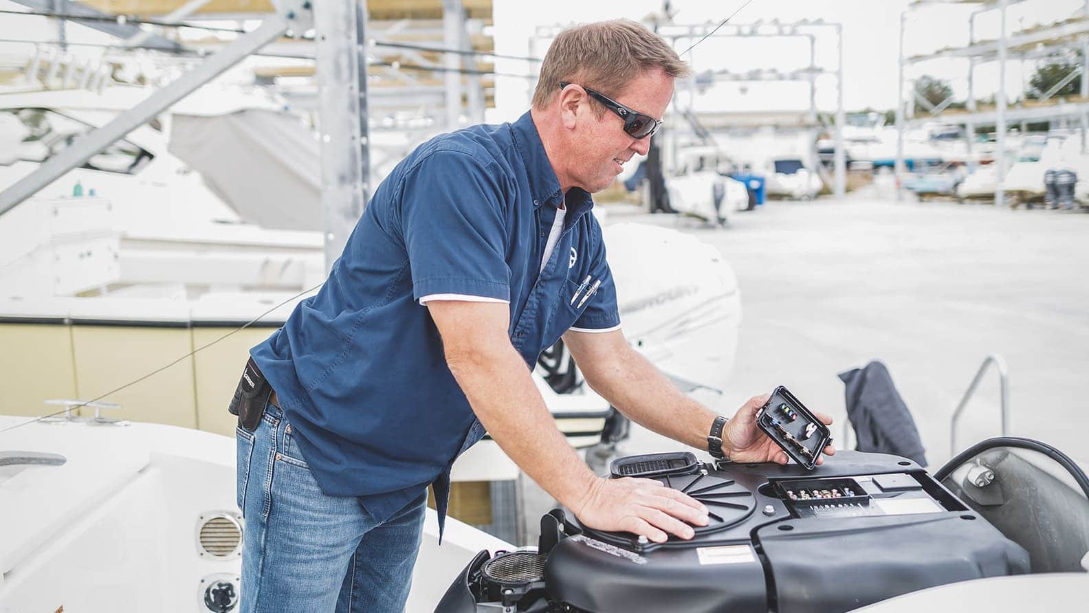 man fixing engine