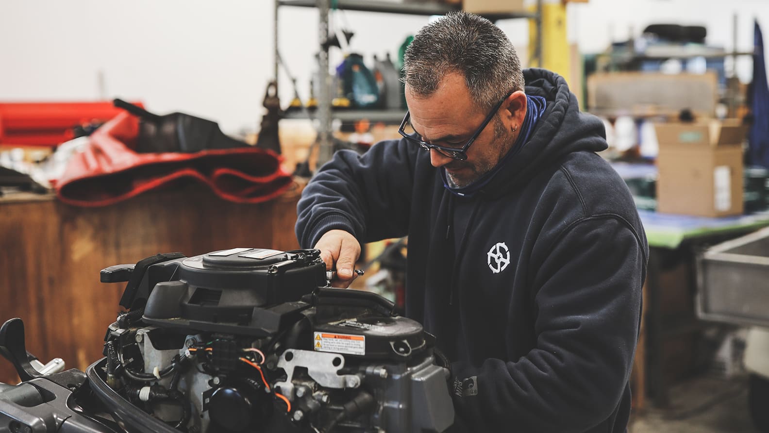 man fixing engine