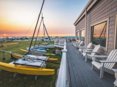 chairs on a porch during sunset