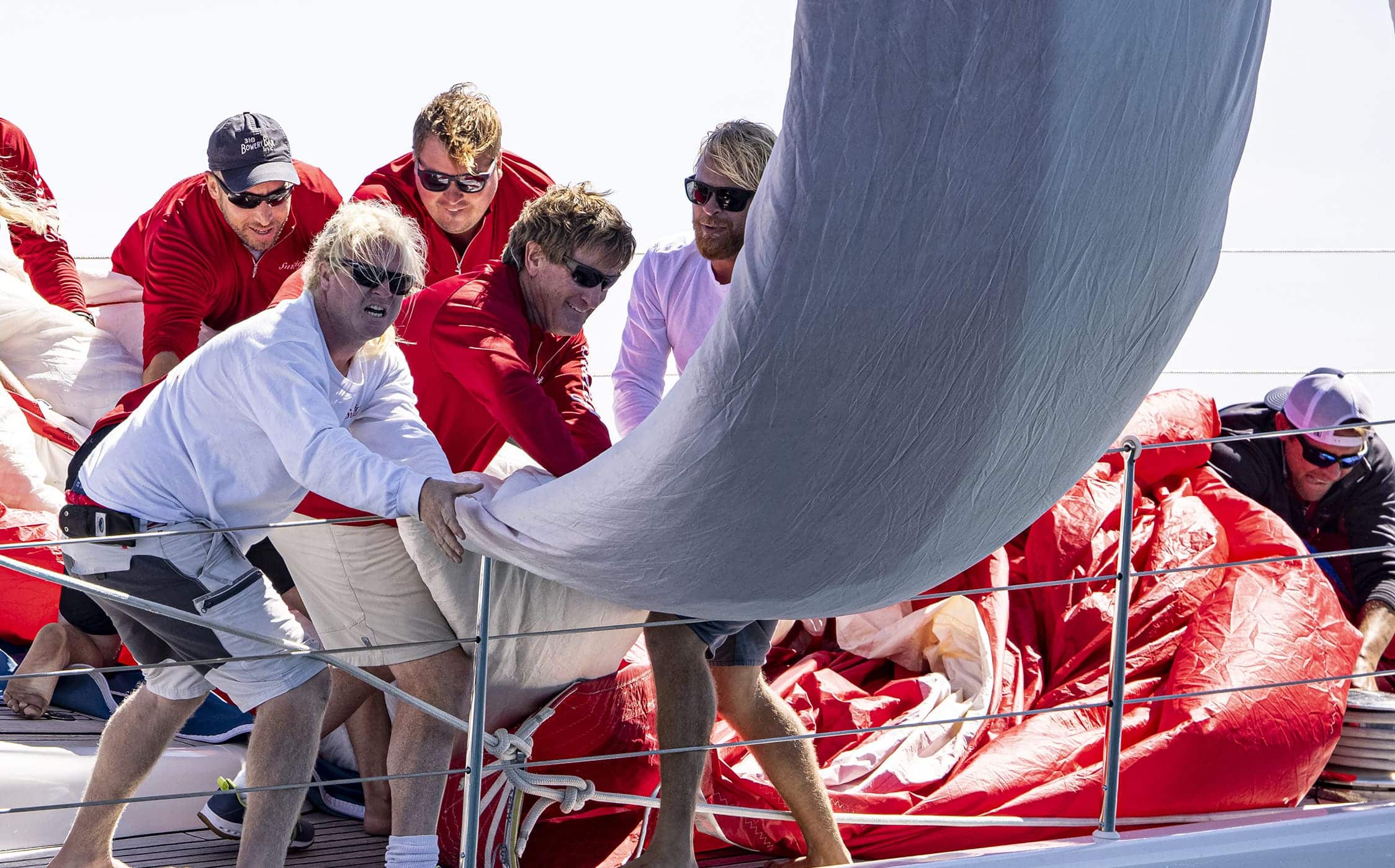 men pulling on a flag