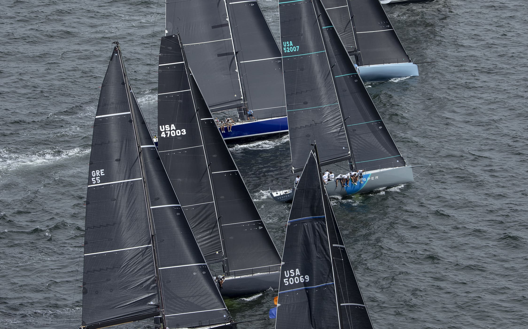 6 sailboats in water