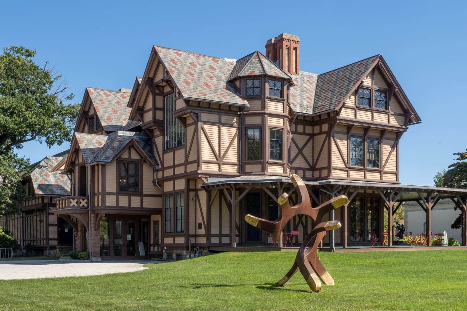 large building with sculpture in front