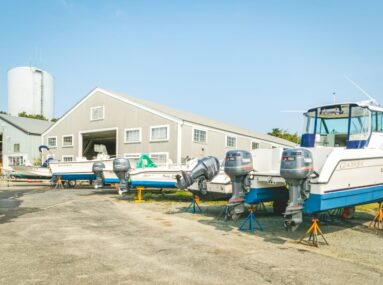 Boats on land outside of marina facility