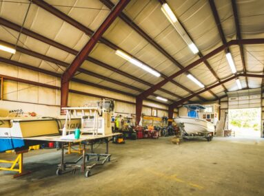 warehouse with a couple boats